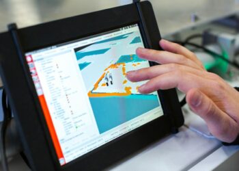 person holding black tablet computer